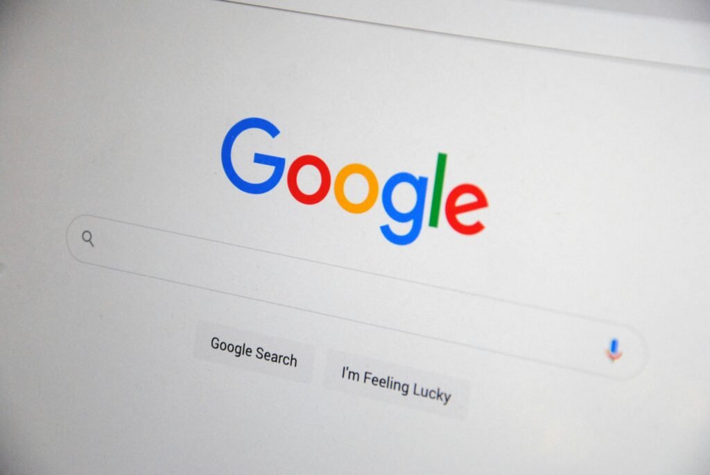 Close-up view of the Google homepage featuring the multicolored Google logo, a search bar, and two buttons labeled "Google Search" and "I'm Feeling Lucky."